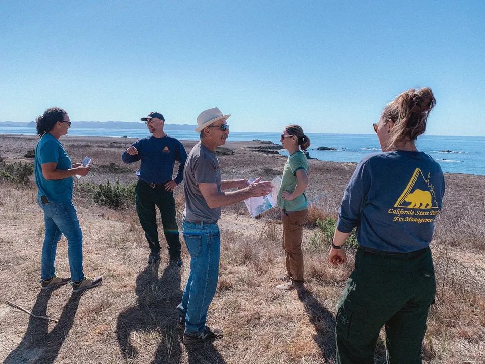 Staff carrying out a community wildfire risk assessment in the field